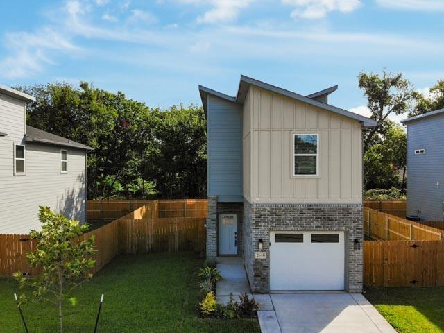 2642 Sutton Street Dallas, TX 75210 - Photo 3 of 12 a front view of a house with a garden