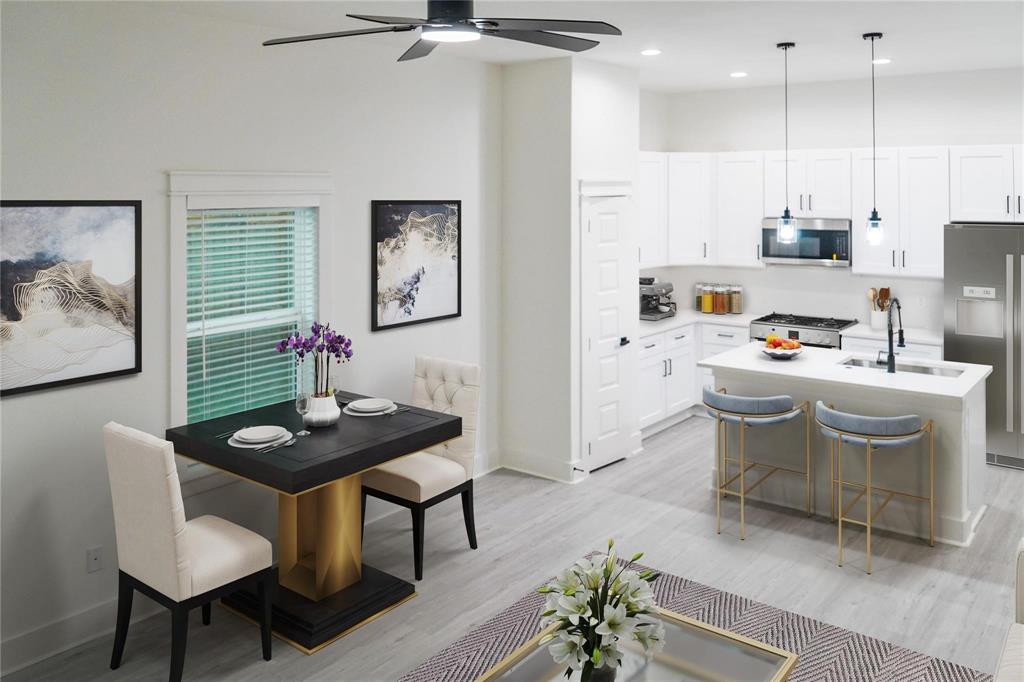 2642 Sutton Street Dallas, TX 75210 - Photo 7 of 12 a view of a dining room with furniture and wooden floor