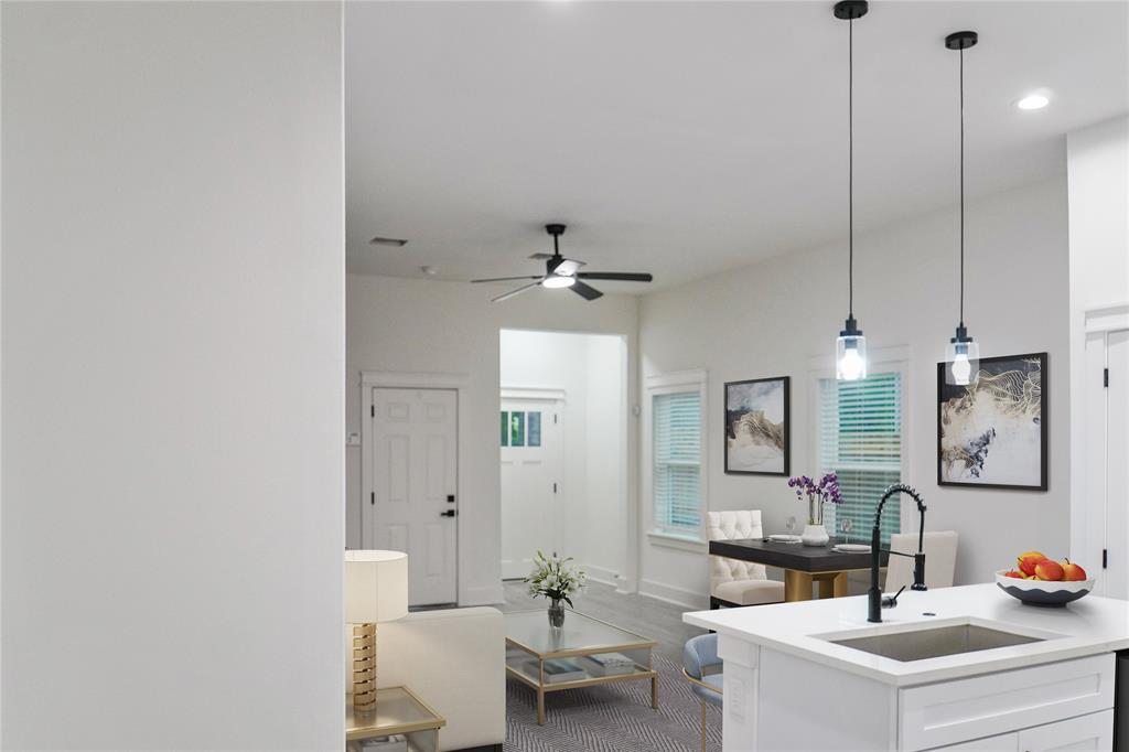 2642 Sutton Street Dallas, TX 75210 - Photo 10 of 12 a living room with furniture and a chandelier