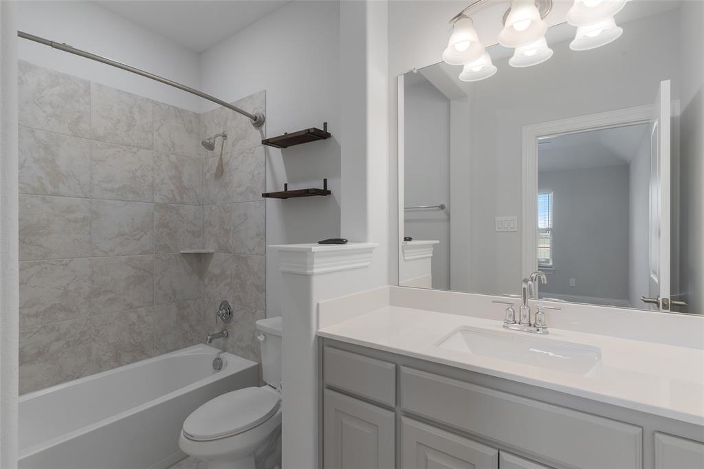 4028 Yellow Jasmine Lane Heath, TX 75126 - Photo 26 of 38 Full bath featuring shower / washtub combination, vanity, and toilet