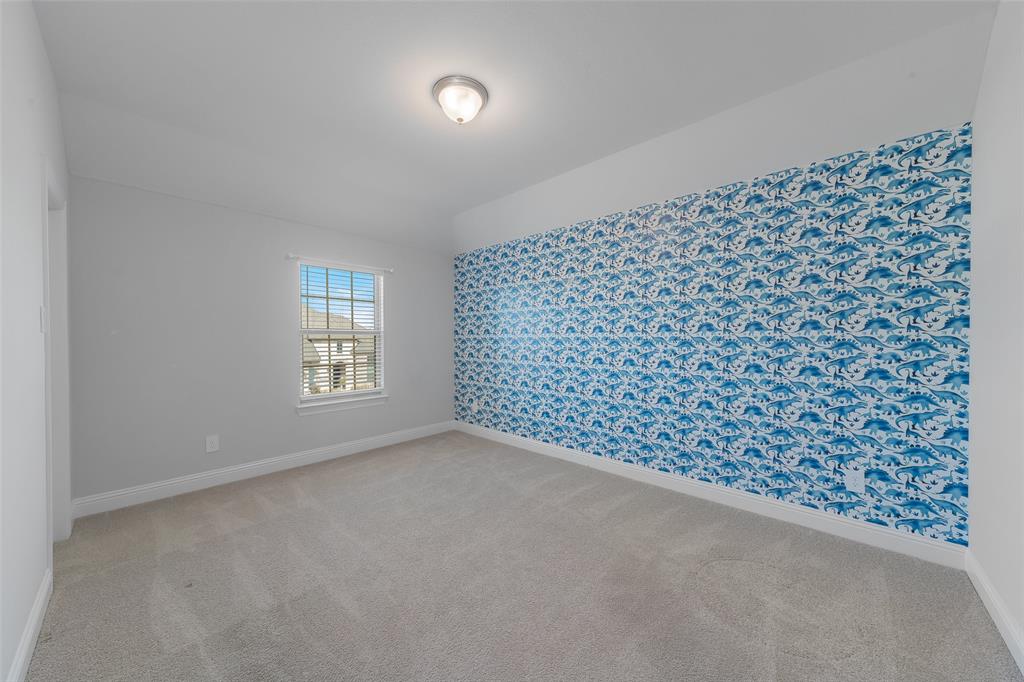 4028 Yellow Jasmine Lane Heath, TX 75126 - Photo 27 of 38 Empty room with carpet floors and baseboards