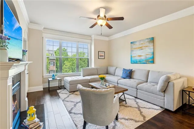a living room with furniture and a fireplace