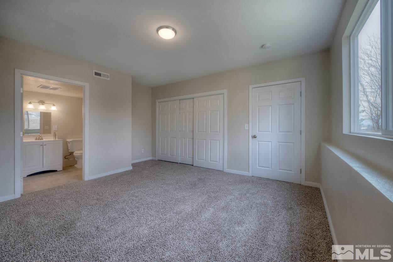 2150 Sutro Street, Unit A Reno, NV 89512 - Photo 14 of 25 a view of an empty room with a window