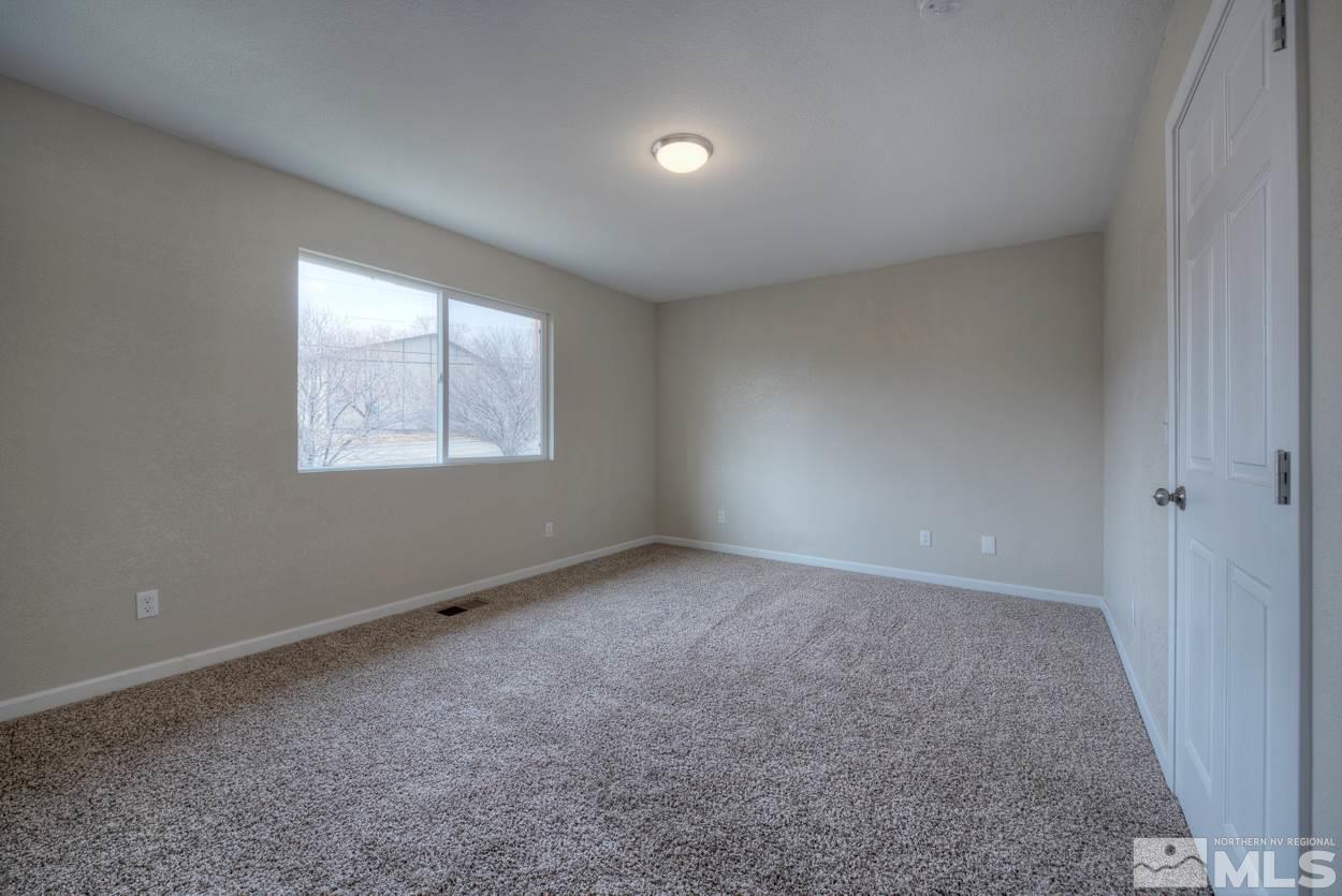 2150 Sutro Street, Unit A Reno, NV 89512 - Photo 16 of 25 an empty room with windows