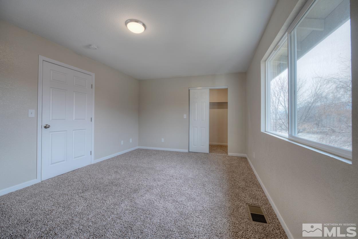 2150 Sutro Street, Unit A Reno, NV 89512 - Photo 17 of 25 an empty room with windows