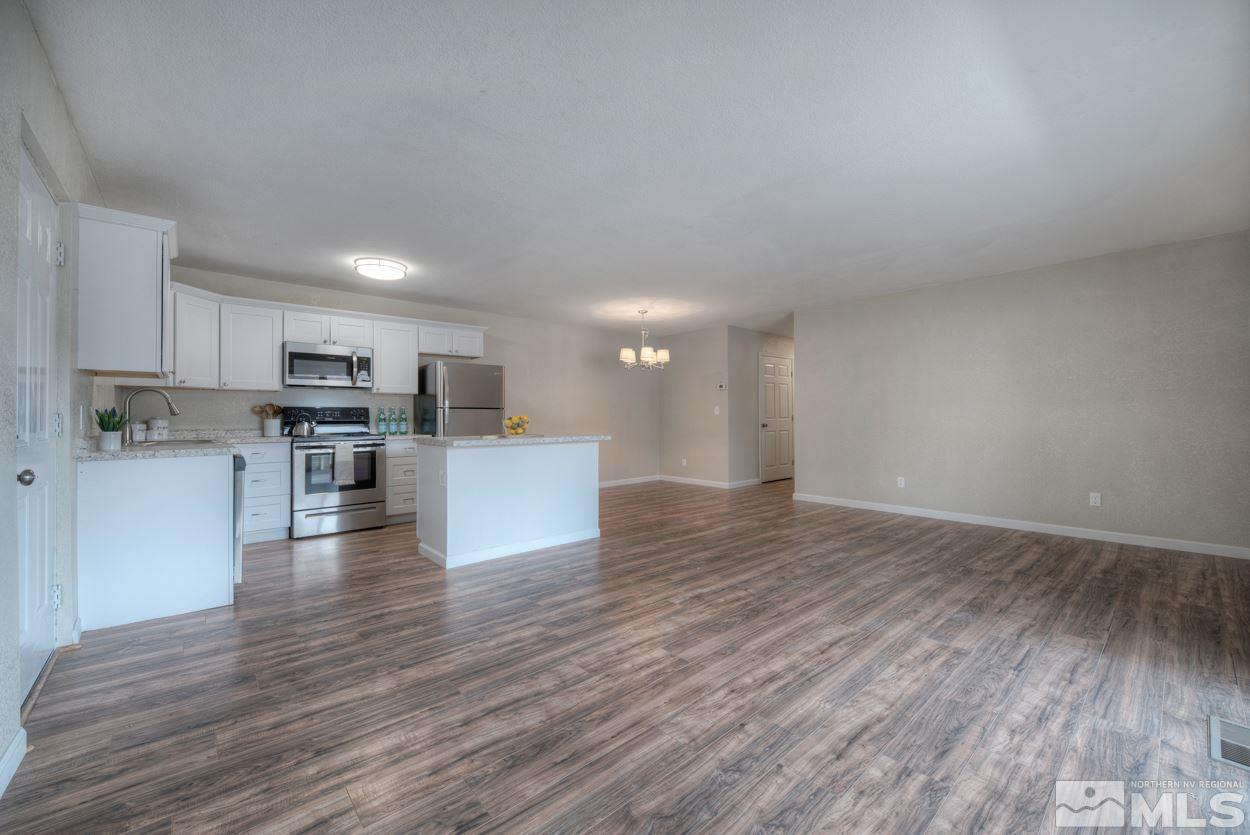 2150 Sutro Street, Unit A Reno, NV 89512 - Photo 3 of 25 a view of kitchen with wooden floor