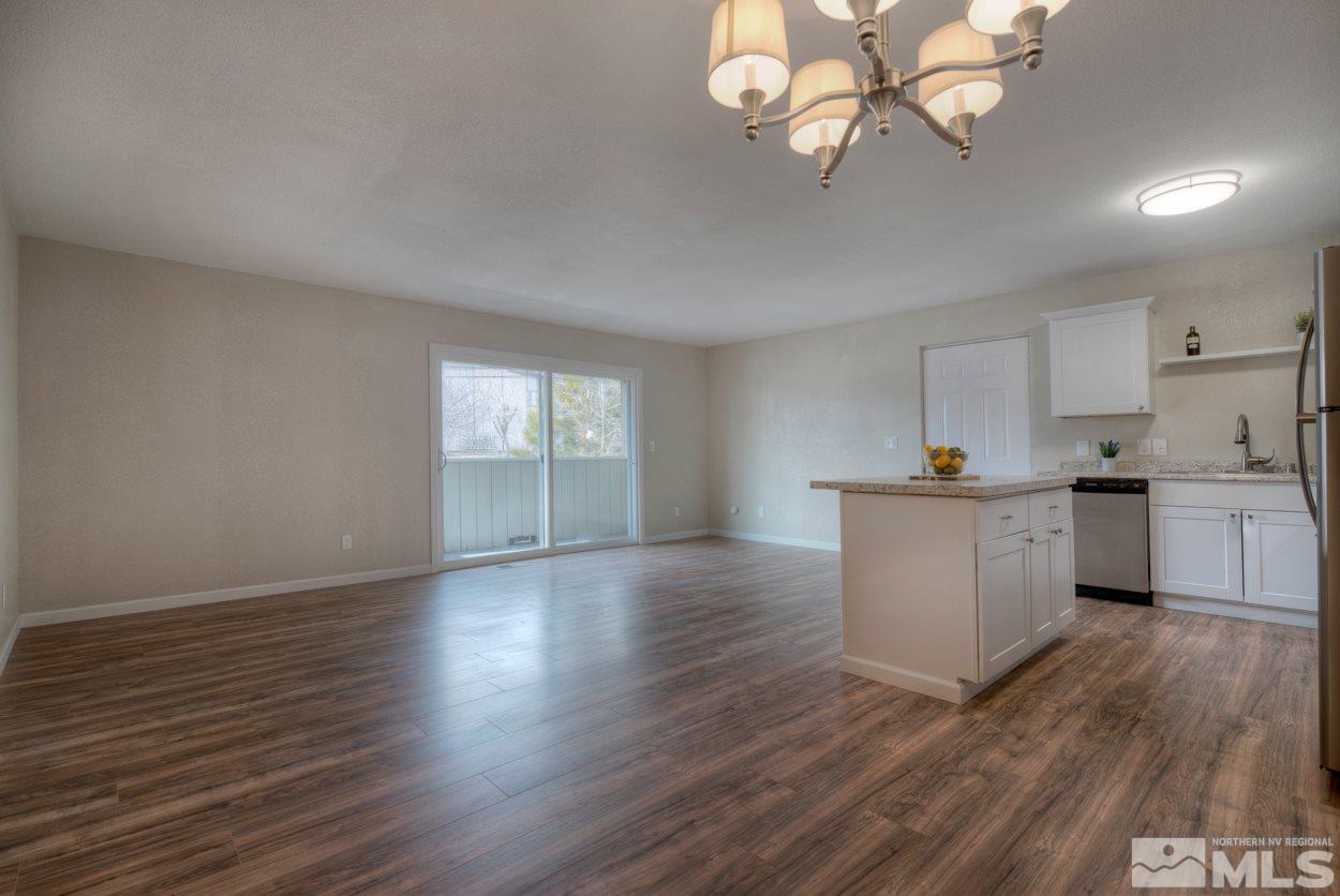 2150 Sutro Street, Unit A Reno, NV 89512 - Photo 6 of 25 a view of a kitchen with wooden floor and a window