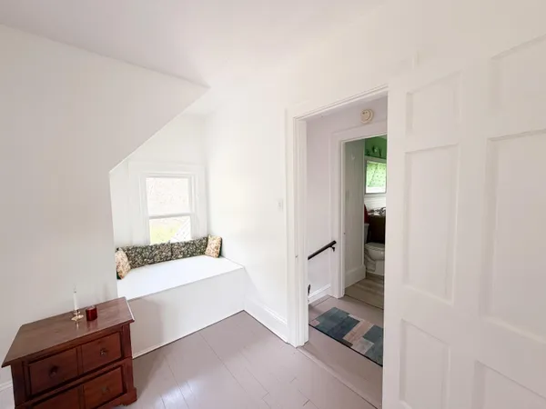 a room with furniture and view of entryway
