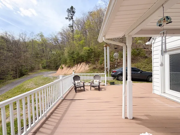 a view of a patio with a table and chairs