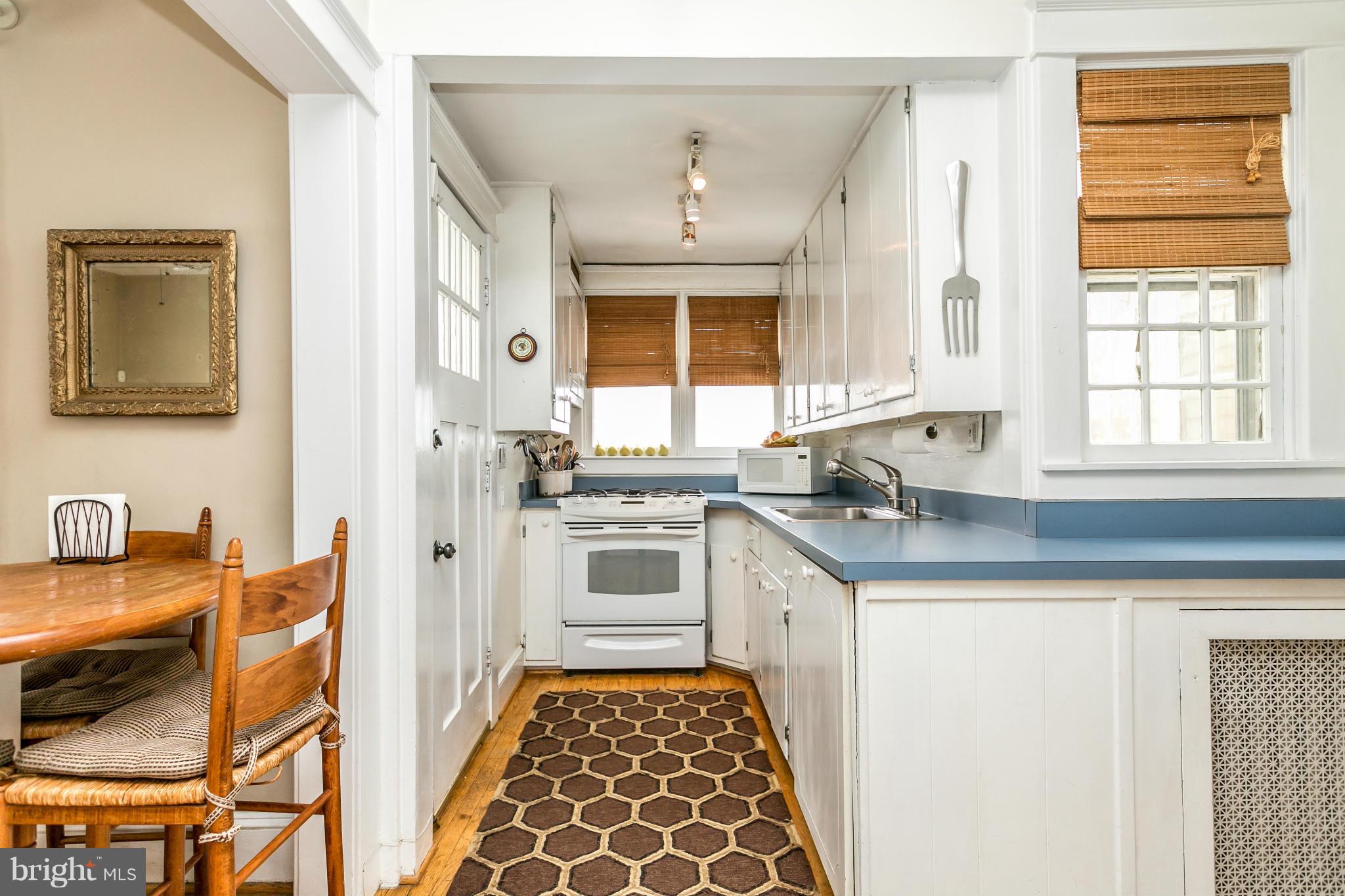 408 Hollen Road Baltimore, MD 21212 - Photo 14 of 30 a kitchen with granite countertop a sink and a stove top oven