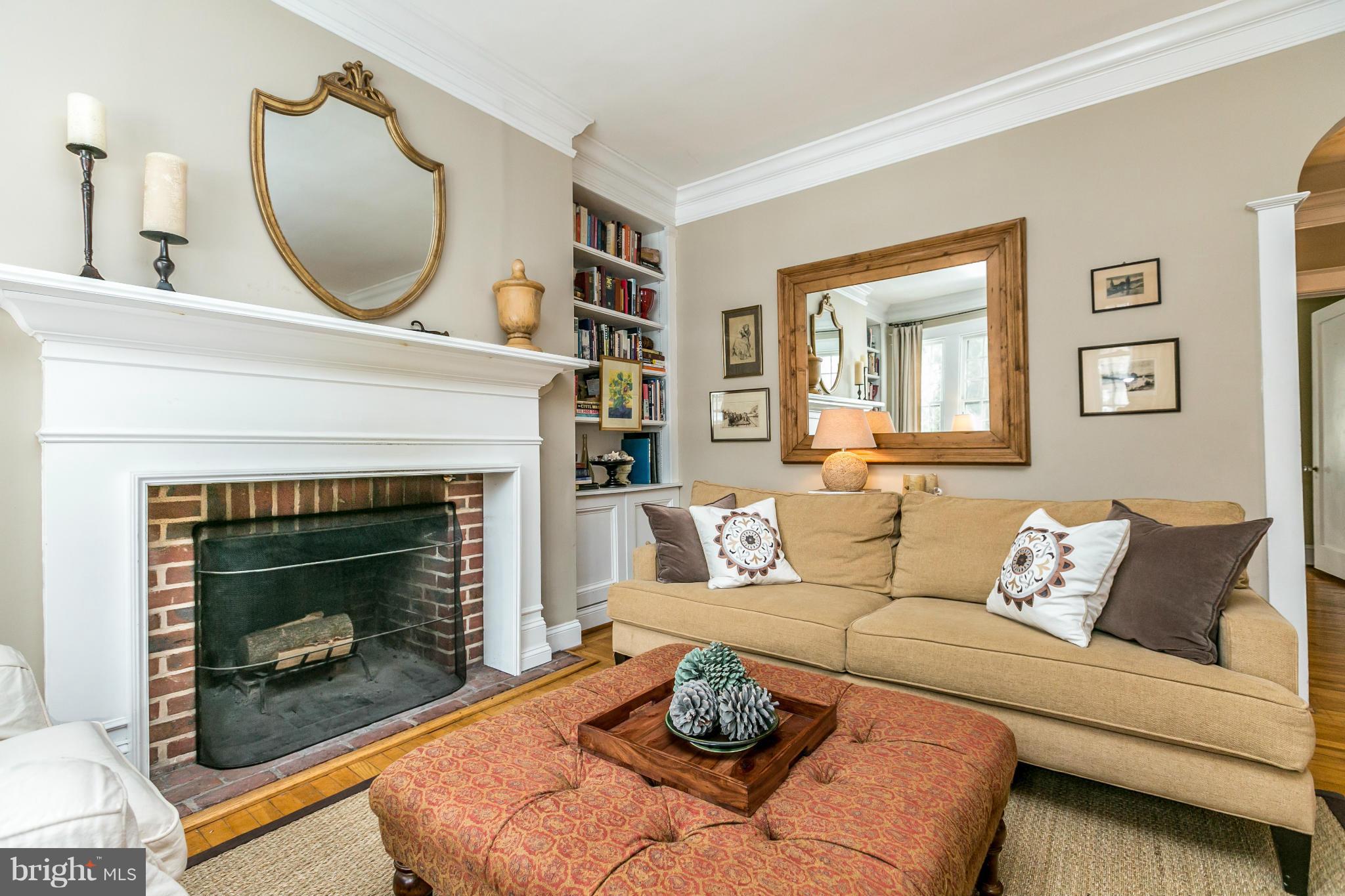 408 Hollen Road Baltimore, MD 21212 - Photo 3 of 30 a living room with furniture a window and a fireplace