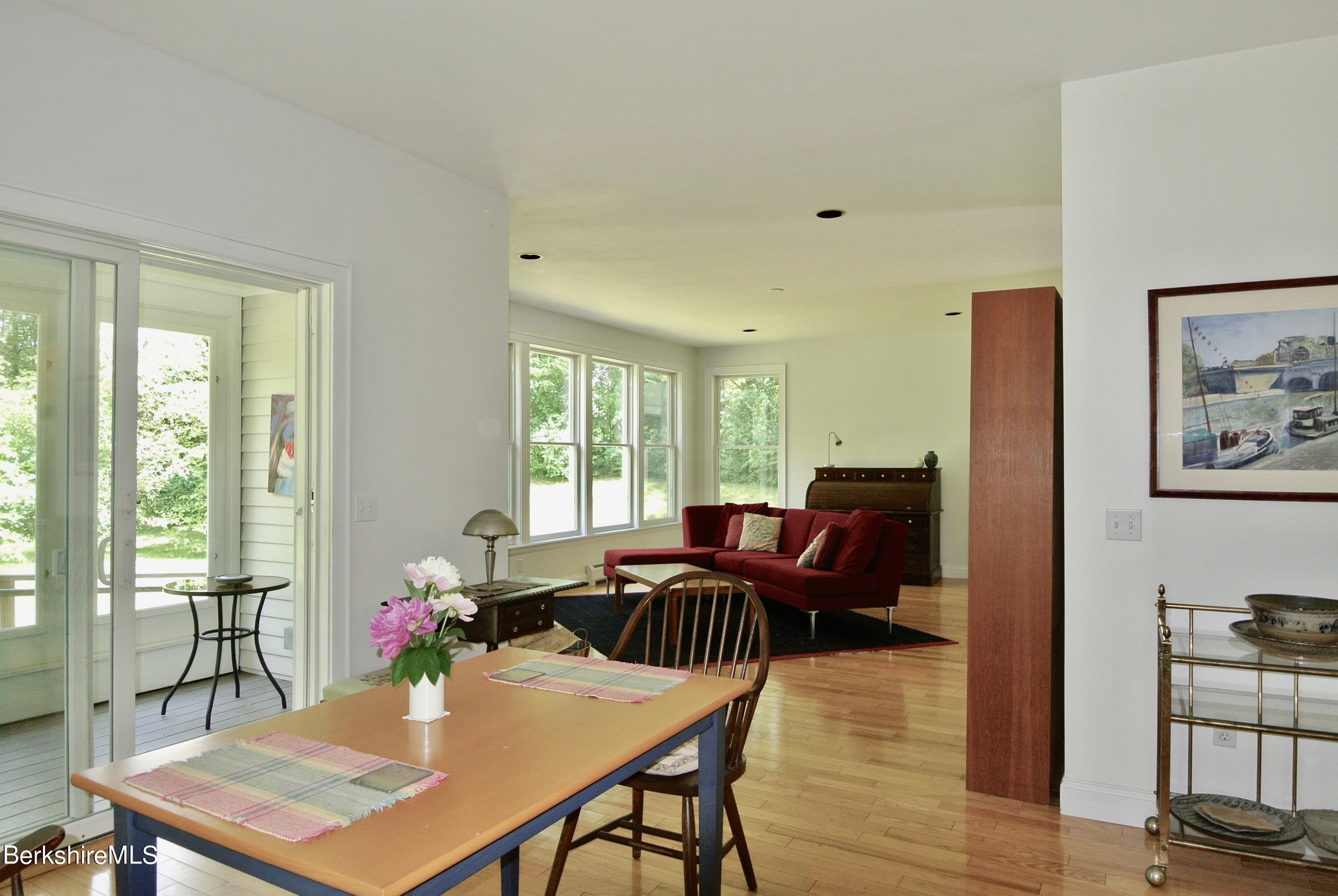 65 Monument Valley Road Great Barrington, MA 01230 - Photo 8 of 32 Dining room to living room with porch