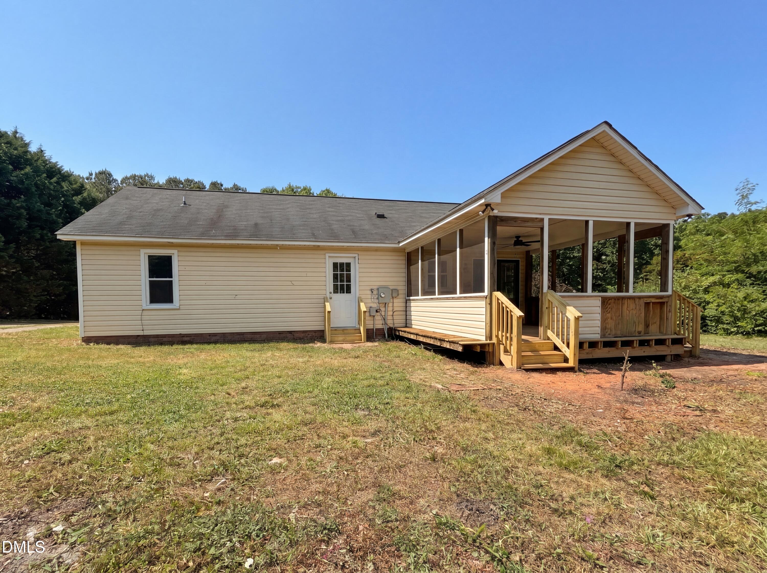4894 Elevation Road, Unit C Benson, NC 27504 - Photo 20 of 24 a view of a house with backyard porch and sitting area