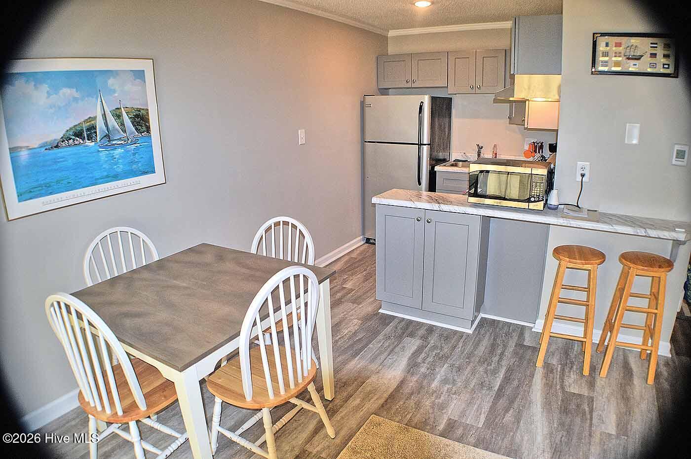2250 New River Inlet Road, Unit 117 North Topsail Beach, NC 28460 - Photo 8 of 16 Kitchen and Dining Areas