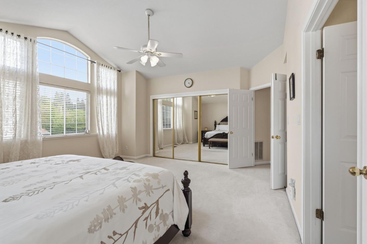 35 Sierra Ridge Court Danville, CA 94506 - Photo 21 of 37 a spacious bedroom with a bed mirror and window