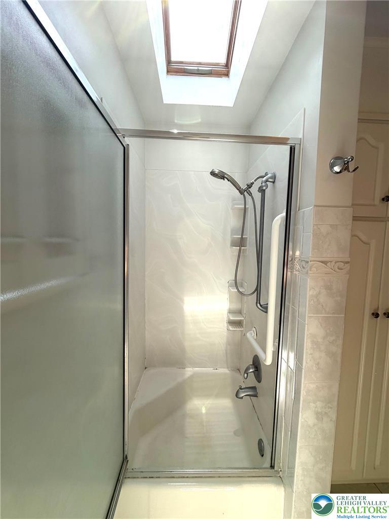2741 Limestone Street Coplay, PA 18037 - Photo 17 of 35 a bathroom with a glass shower door