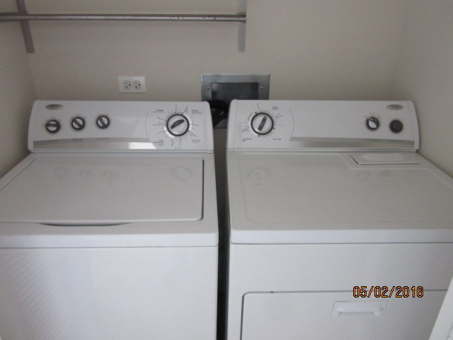 4848 North Sheridan Road, Unit 802 Chicago, IL 60640 - Photo 11 of 11 a utility room with dryer and washer