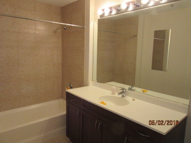4848 North Sheridan Road, Unit 802 Chicago, IL 60640 - Photo 10 of 11 a bathroom with a sink and a mirror