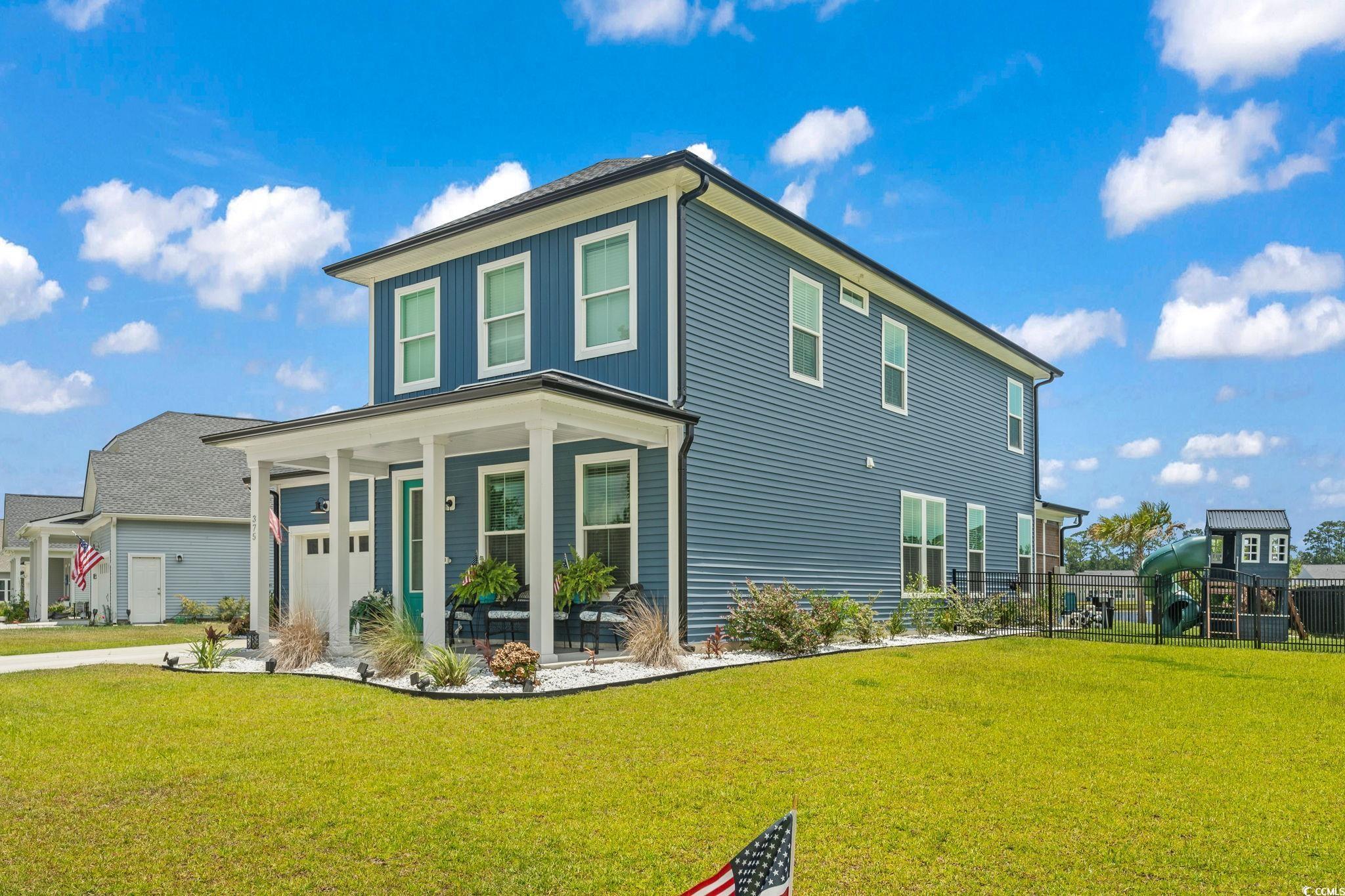 375 Bumble Circle Murrells Inlet, SC 29576 - Photo 1 of 40 Exterior space with a porch and a yard