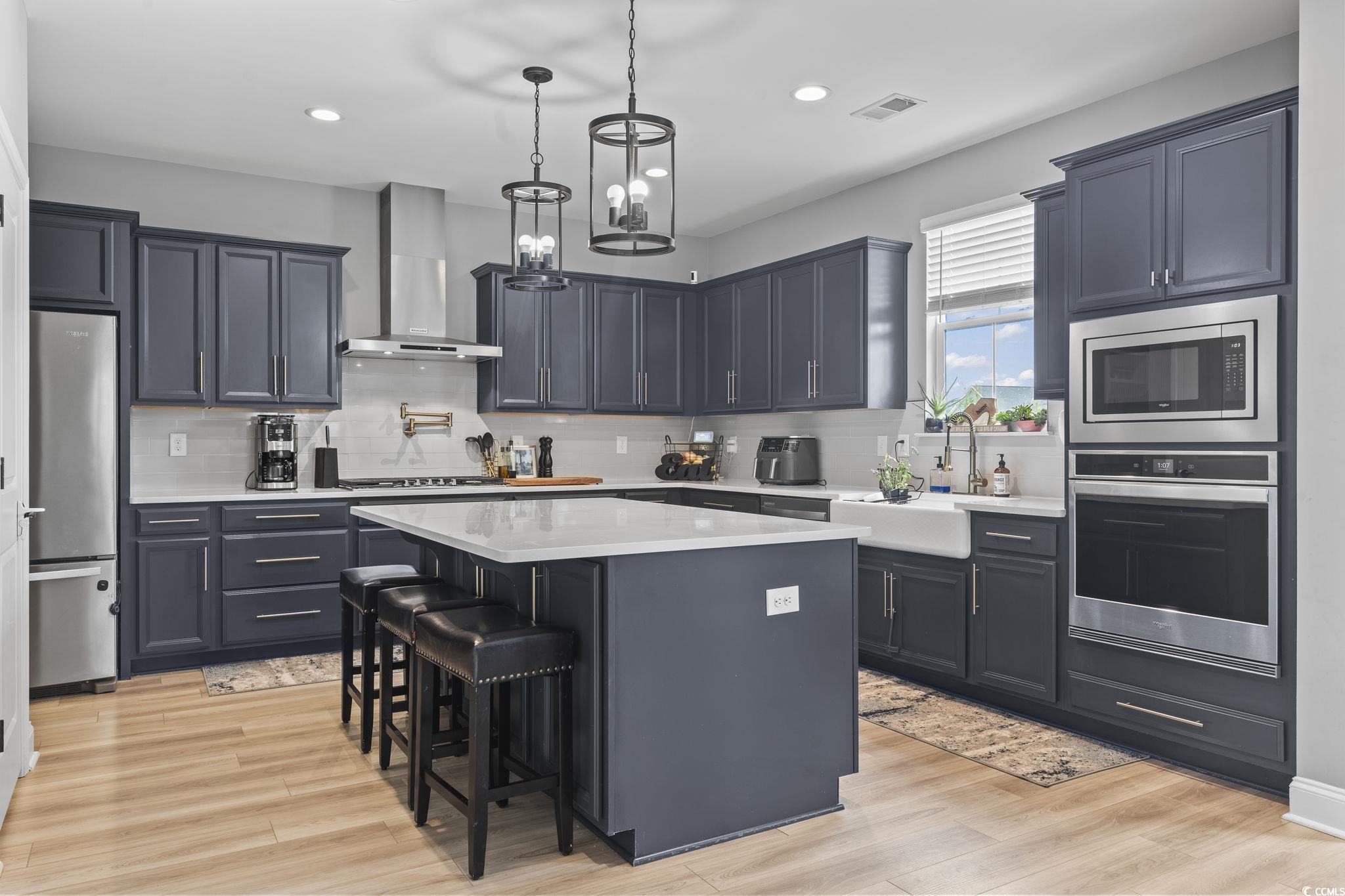 375 Bumble Circle Murrells Inlet, SC 29576 - Photo 13 of 40 Kitchen featuring a center island, wall chimney ex