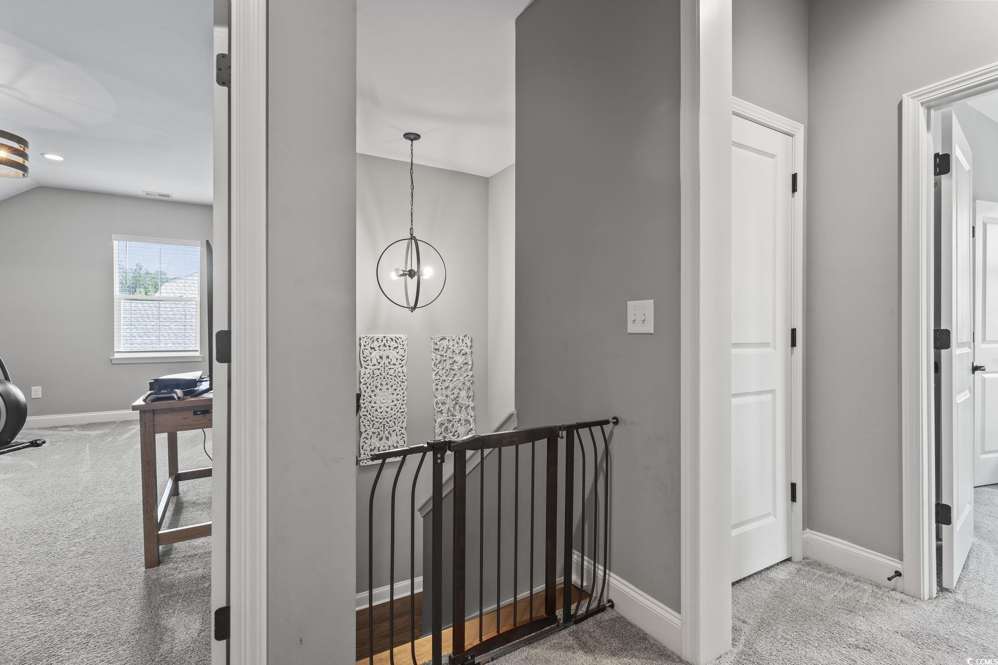 375 Bumble Circle Murrells Inlet, SC 29576 - Photo 18 of 40 Corridor with a notable chandelier, lofted ceiling
