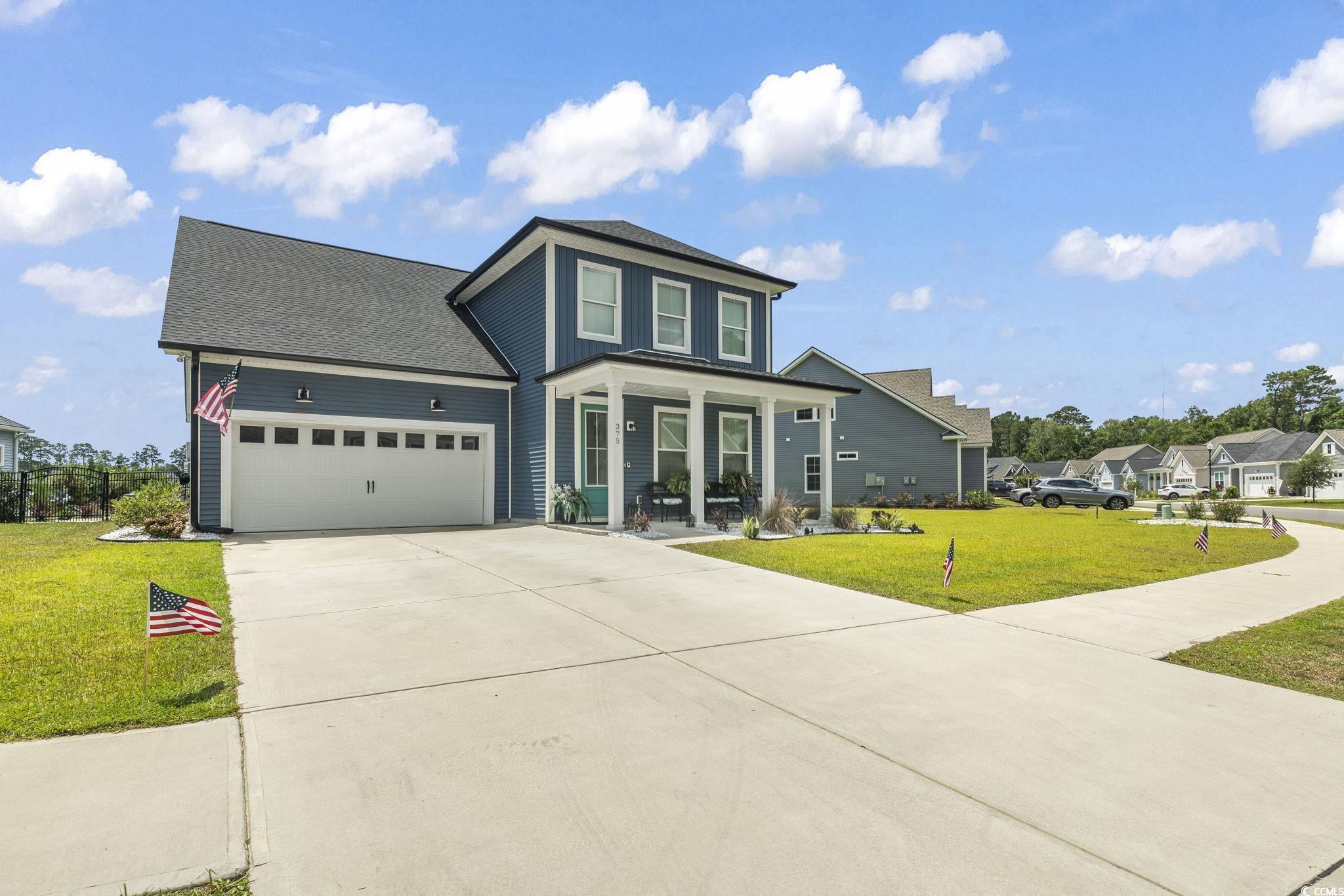 375 Bumble Circle Murrells Inlet, SC 29576 - Photo 28 of 40 View of front facade with a porch, a garage, and a
