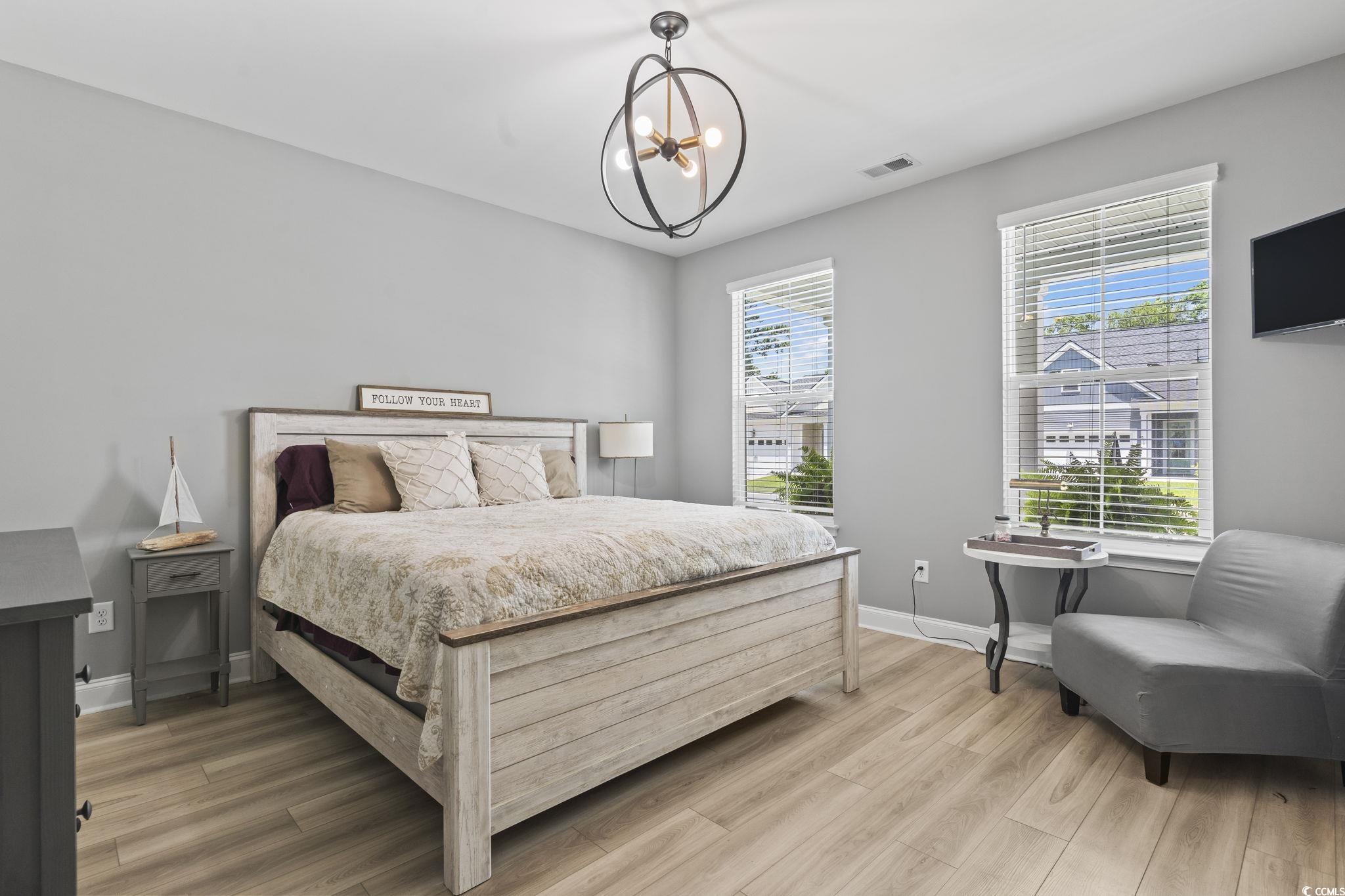 375 Bumble Circle Murrells Inlet, SC 29576 - Photo 6 of 40 Bedroom with wood-type flooring and a notable chan