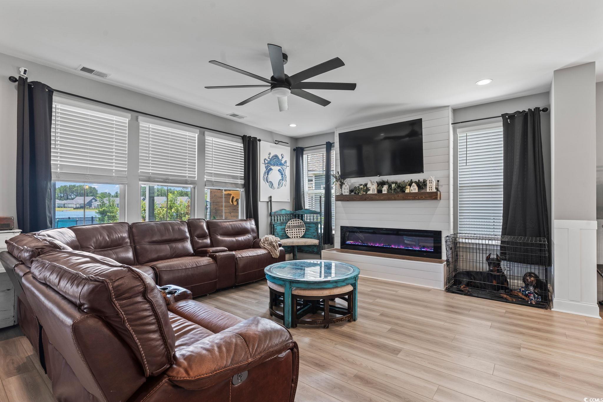 375 Bumble Circle Murrells Inlet, SC 29576 - Photo 10 of 40 Living room featuring ceiling fan, a fireplace, an