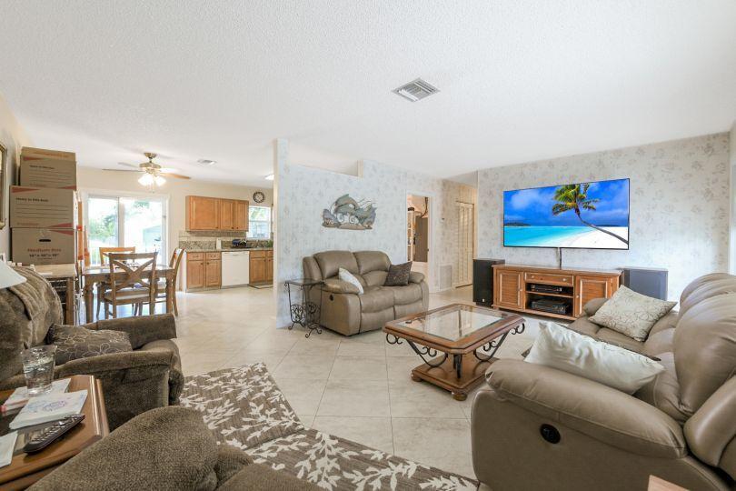 5547 3rd Road Lake Worth, FL 33467 - Photo 5 of 34 a living room with furniture and a view of kitchen