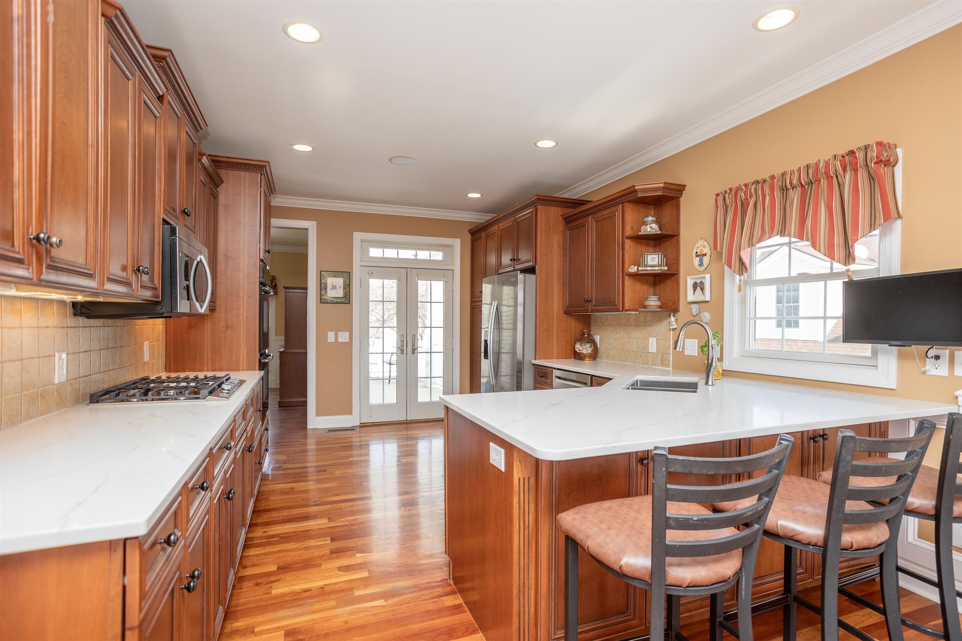 203 Keswick Circle Dayton, VA 22821 - Photo 18 of 73 a kitchen with stainless steel appliances granite countertop a stove a sink and a refrigerator