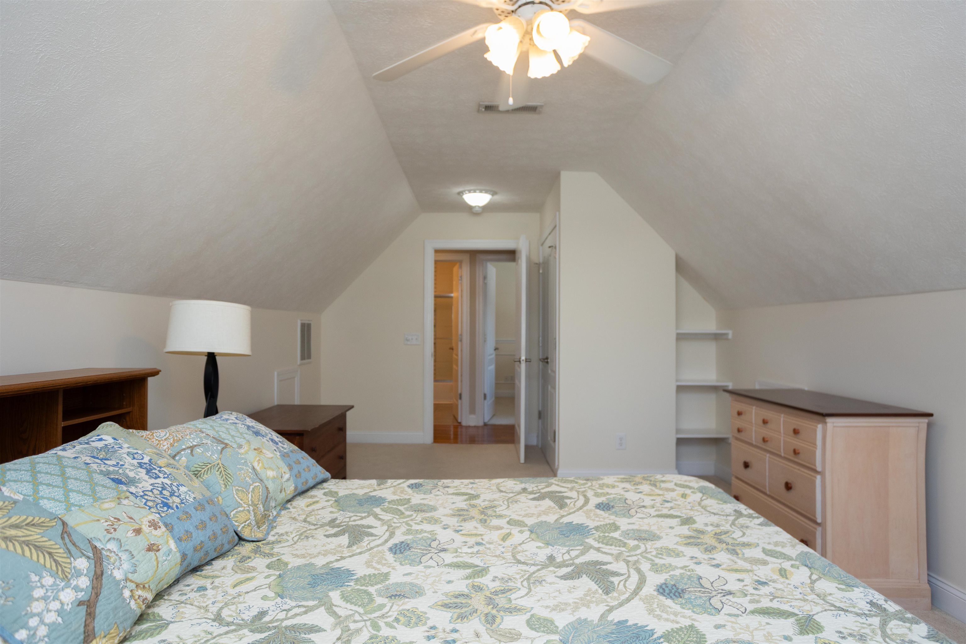 203 Keswick Circle Dayton, VA 22821 - Photo 35 of 73 a bedroom with a large bed and a chandelier