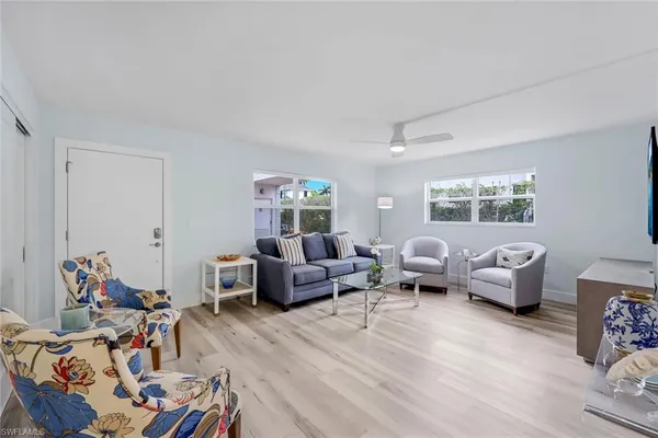 a living room with furniture and a window