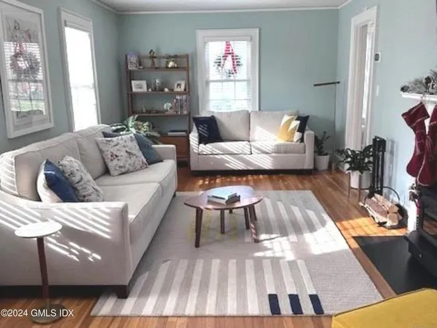 a spacious bedroom with a bed and dresser