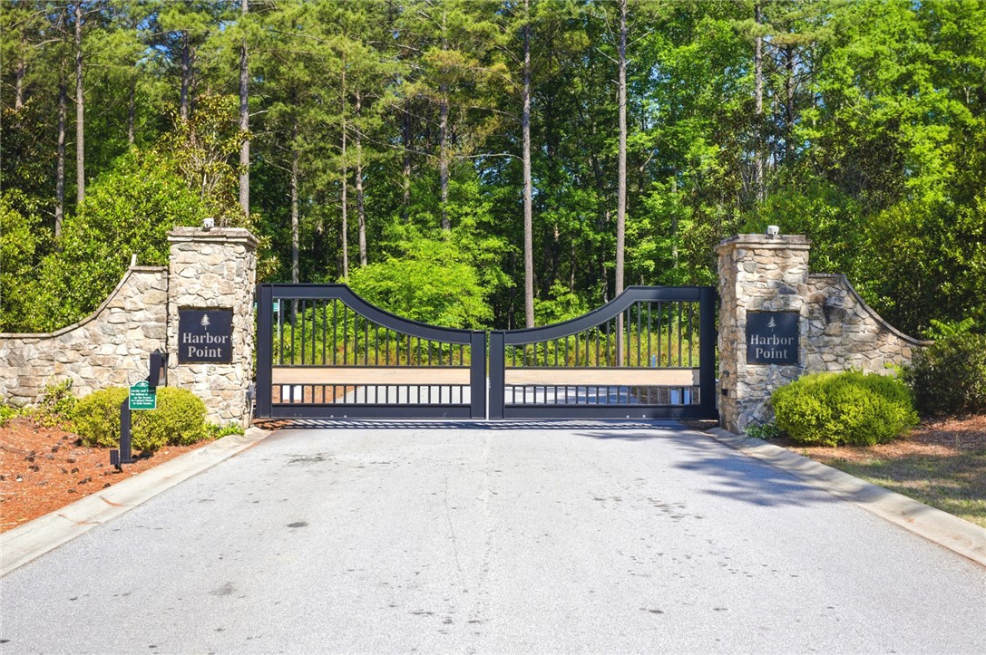 Secure entry to a private community, featuring impressive stone pillars and elegant gates.