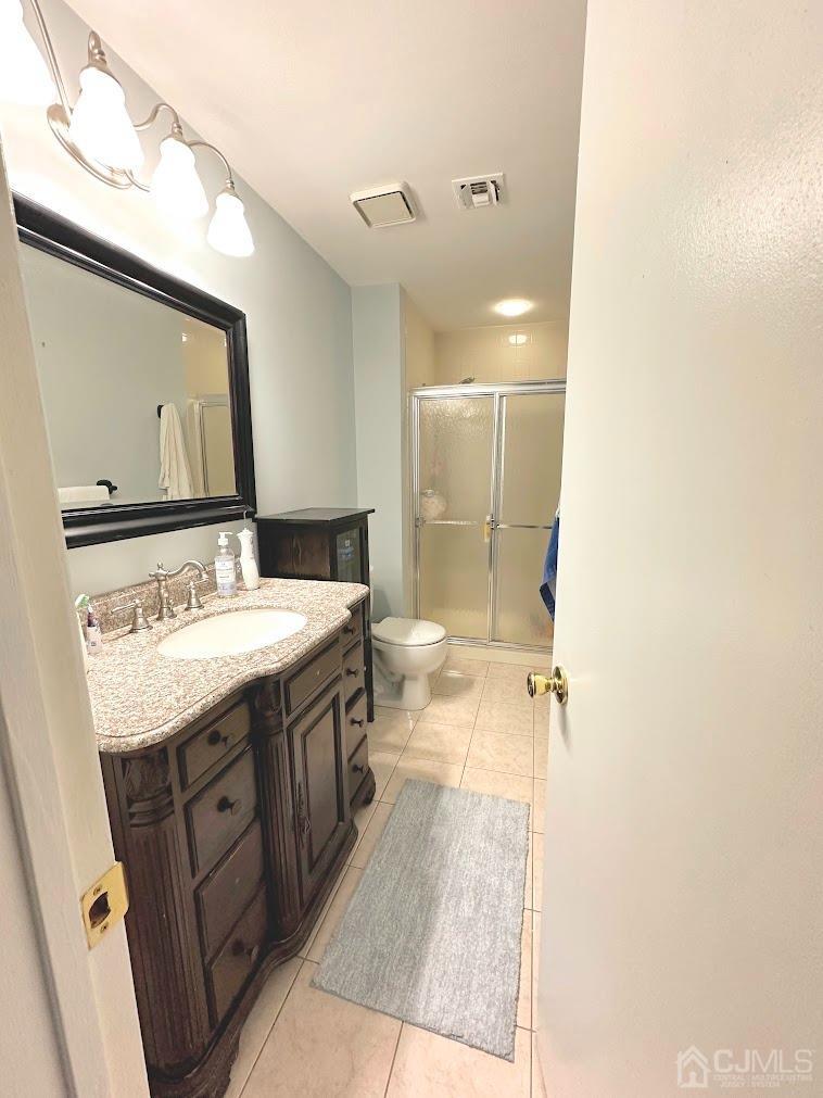 60 County Road, Unit 33F Cliffwood, NJ 07721 - Photo 12 of 13 a spacious bathroom with a granite countertop sink mirror and a