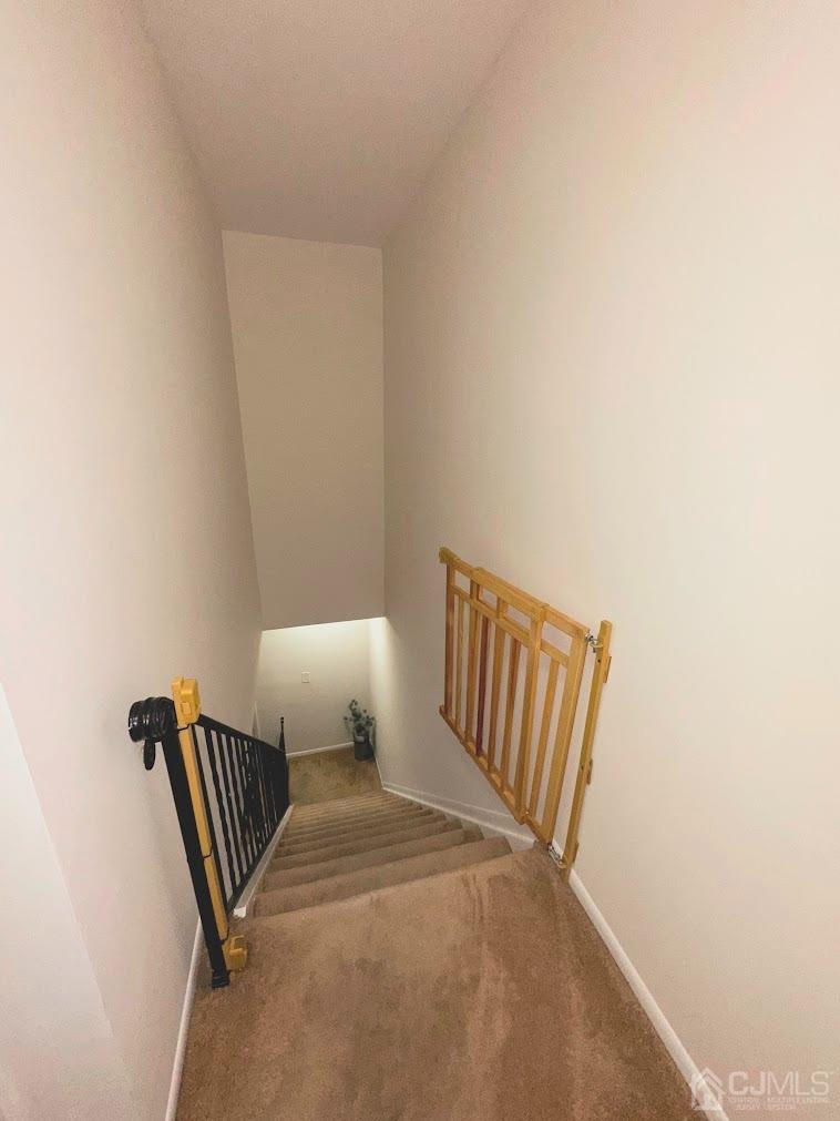 60 County Road, Unit 33F Cliffwood, NJ 07721 - Photo 9 of 13 a bedroom with a chair and wooden floor