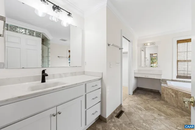a bathroom with a shower and a sink