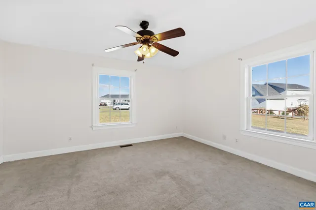 a view of a livingroom with a ceiling fan