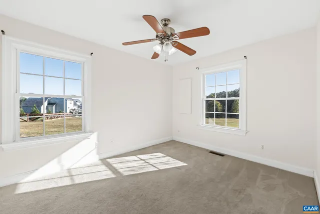 an empty room with a window and a table