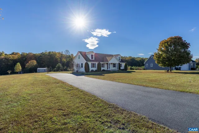 a view of house with backyard and outdoor space