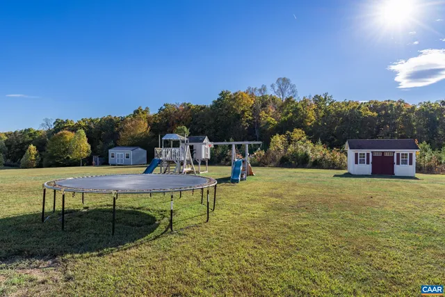 a backyard of a house with lots of green space
