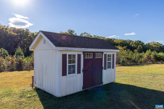 a view of a big room with table and chairs