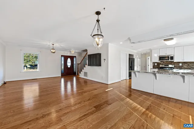 a view of a kitchen with microwave and cabinets