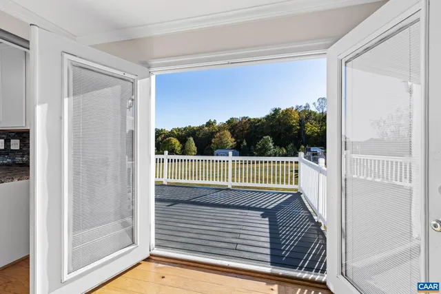 a kitchen with granite countertop a refrigerator oven a sink a counter space and cabinets