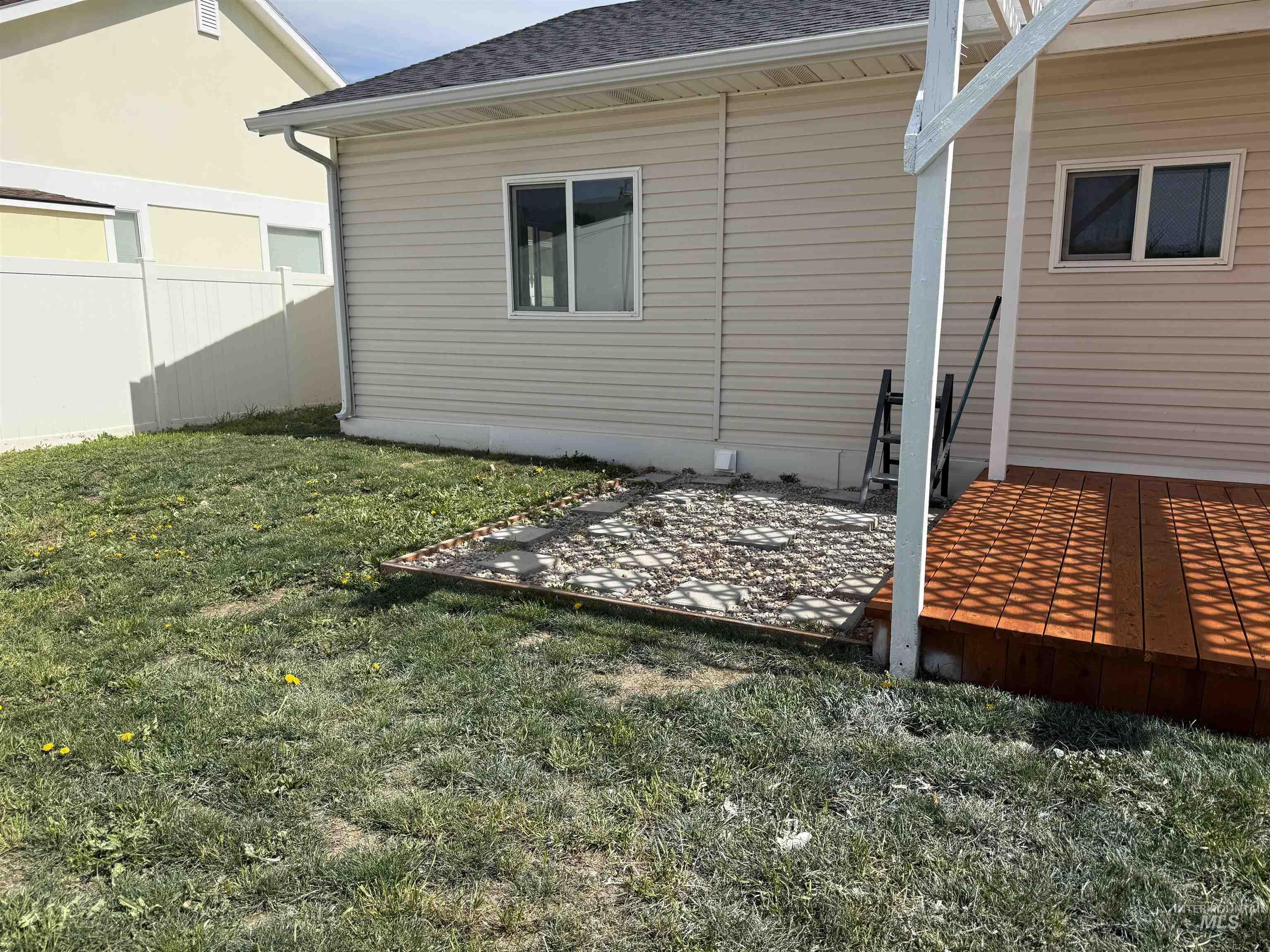 523 Morning Dove Way Marsing, ID 83639 - Photo 6 of 23 Rear view of house featuring roof with shingles and a patio