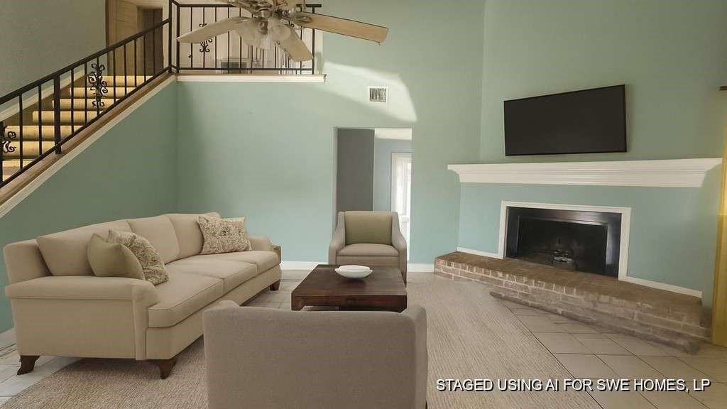 a living room with furniture and a fireplace