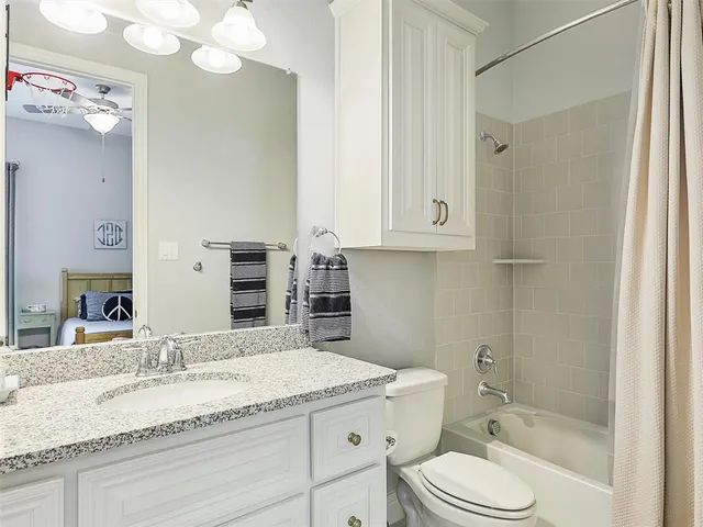 a en suite spacious bathroom with a tub shower and sink