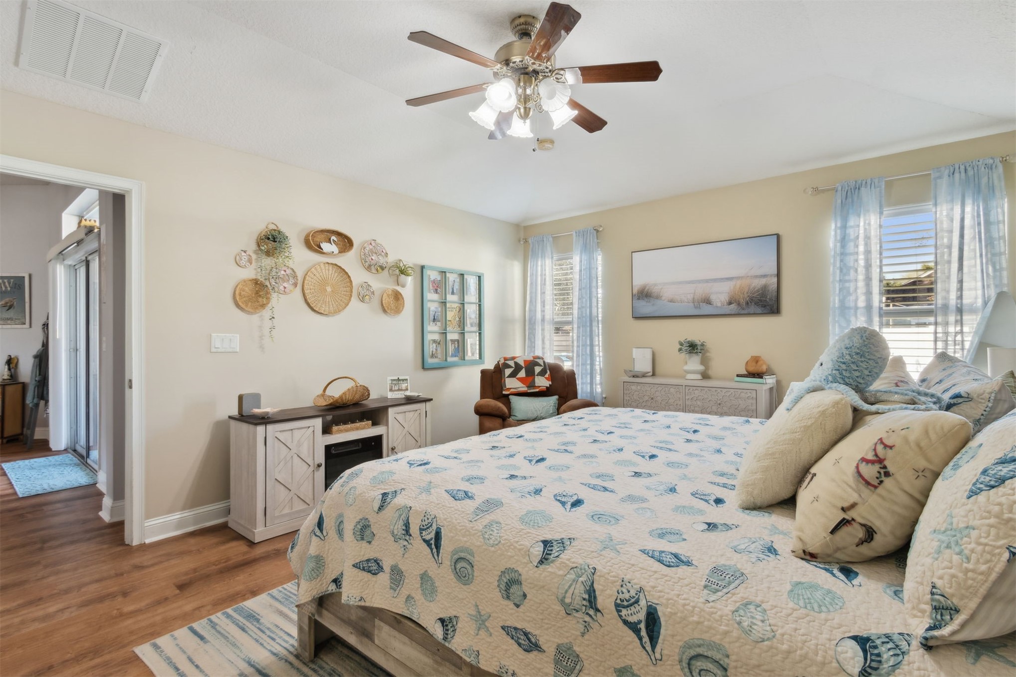 86027 Maple Leaf Place Yulee, FL 32097 - Photo 20 of 38 a bedroom with a bed and a chandelier