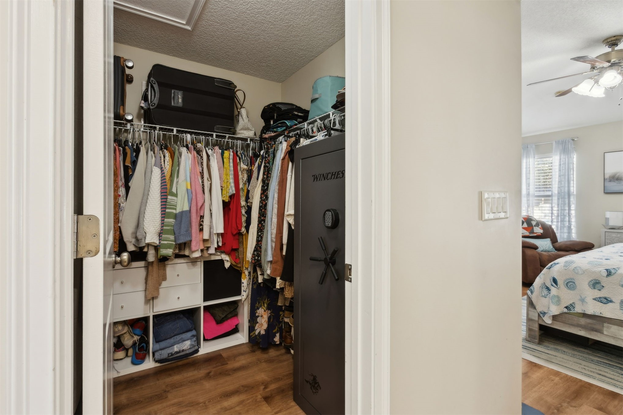 86027 Maple Leaf Place Yulee, FL 32097 - Photo 25 of 38 a view of walk in closet with clothes and shoes