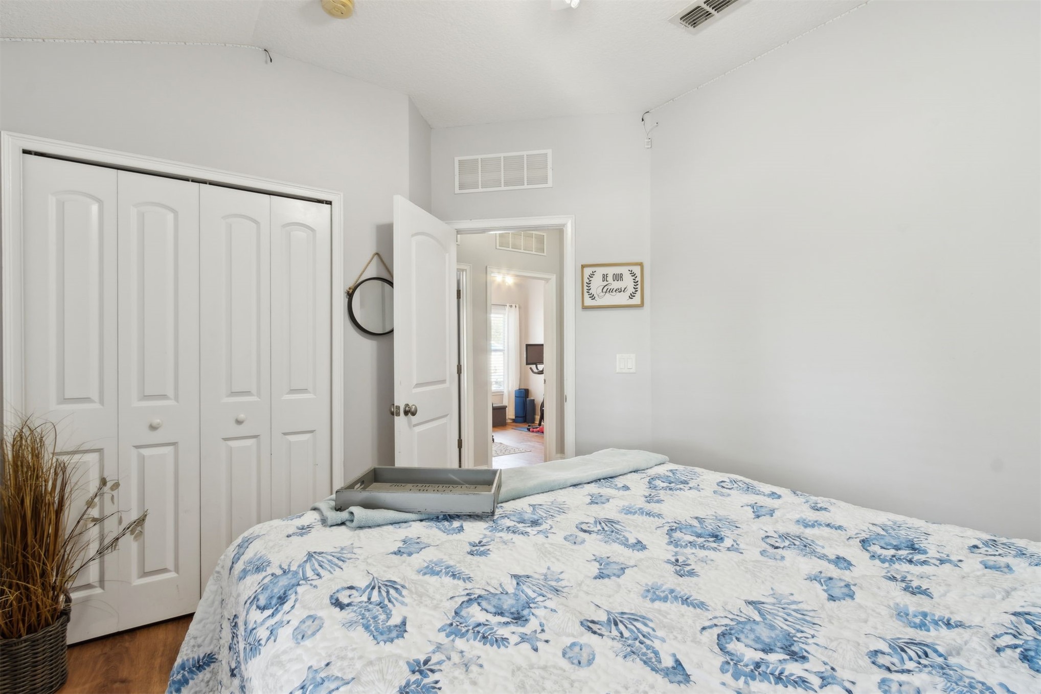 86027 Maple Leaf Place Yulee, FL 32097 - Photo 27 of 38 a bedroom with a bed and a mirror